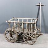 A Continental wooden and metal bound hand cart with slatted sides, 32ins wide x 22ins deep x 23.5ins