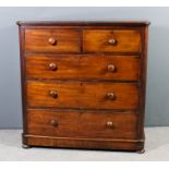 A Victorian mahogany chest with rounded front corners and moulded edge to top, fitted two short