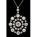 A gold and silvery coloured metal mounted all diamond set pendant, the central collet set old cut