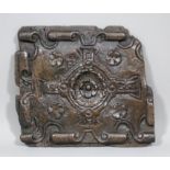 An early 17th Century English oak panel, the centre carved with a Tudor Rose within a strapwork