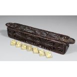 A rare 17th Century chip carved box containing forty-one contemporary and possibly original bone