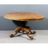 A Victorian figured walnut oval breakfast table, the quarter veneered top with moulded edge, on