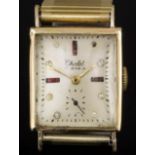 A 1950s gentleman's gold cased Chalet wristwatch, the champagne silvered face with semi-precious