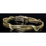 A 1970s 14ct gold double wave link pattern bracelet with four leaf pattern fixings, 205mm overall (