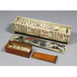 An early 19th Century French Prisoner of War carved and painted bone domino set, comprising box