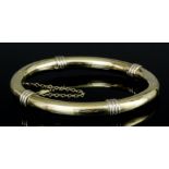 A modern 9ct gold stiff pattern bangle, quarter set with reeded decoration (gross weight 16.8