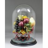 A late Victorian coloured wax composition still life of a basket of fruit, 19.5ins high, on circular