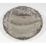 An Elizabeth II silver circular waiter, the rim pierced and cast with fruiting vines, on circular