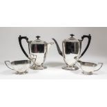 A George VI silver four piece coffee service of octagonal panelled form with moulded rims, angular