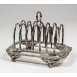 A William IV silver rectangular six division toast rack with moulded double arch divisions,