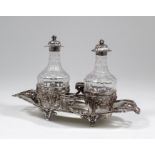 A late 18th Century French silver oil and vinegar bottle stand, the shaped base in the Neo-classical