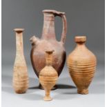 A Roman pottery Unquentarium, 8.25ins high, a small pottery vase with red and black horizontal