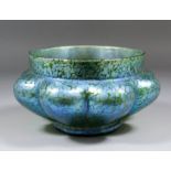 An early 20th Century glass bowl of lobed form in the "Loetz" manner with iridescent oil spot
