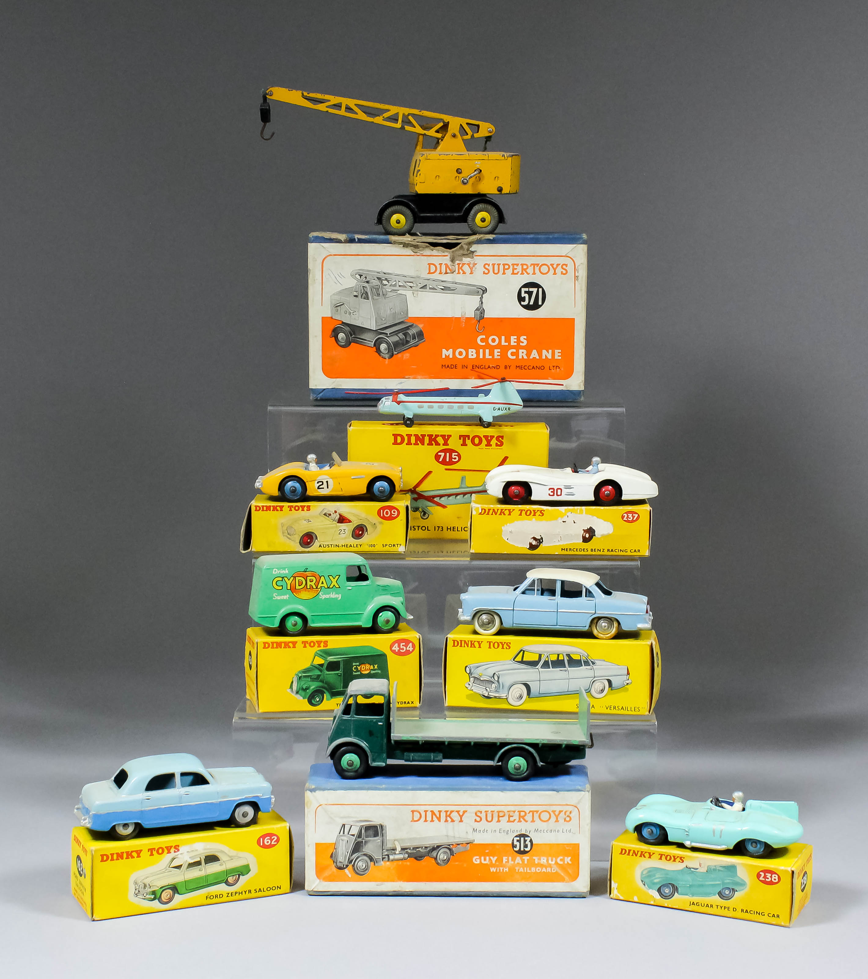 An extensive collection of Dinky diecast toy saloon cars, including - "Mercedes Benz" (No. 237), "