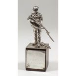 A modern Continental cast silvery metal figure of a World War II British soldier, 5ins high, on