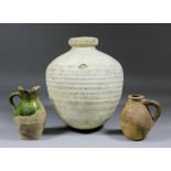 A Surrey "Border Ware" or "Tudor Green Glazed" pottery jug (16th or early 17th Century), 5.75ins