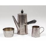 A late Victorian bachelor's silver coffee service with textured finish, comprising - side handled