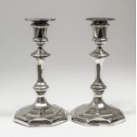 A pair of George V silver octagonal pillar candlesticks, with moulded knops to stem, 7.625ins