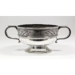 An Edward VII silver circular two handled rose/fruit bowl with moulded mount and girdle and embossed