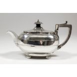 A George III silver bachelors rectangular tea pot with raised band to body, angular handle and on