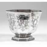 A Continental silvery metal octagonal bowl of panelled form, engraved in the 17th Century style with