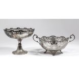 An Edward VII silver circular two-handled bowl with shaped and scroll moulded rim, the sides pierced