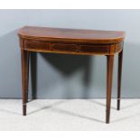 A George III figured mahogany D-shaped card table, crossbanded in rosewood and inlaid with