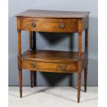 A late Georgian mahogany bow front two tier side table with moulded edge to top, fitted one dummy