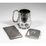 A Victorian silver tankard of tapered form engraved with bands of geometric ornament, with C-