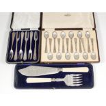 A set of twelve Elizabeth II silver teaspoons with tapered handles pierced with geometric