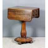 An early Victorian rosewood and grained as rosewood drop leaf work table, fitted two real and two
