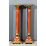 A pair of 20th Century Italian red painted and giltwood square torcheres with fluted columns and