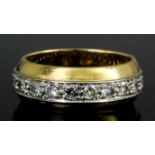 A modern 18ct gold all diamond set full hoop eternity ring, the face channel set with twenty-one