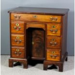 An early George III lady's mahogany kneehole dressing table, the top with moulded edge and re-