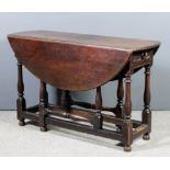 A late 17th/early 18th Century oak oval gateleg table, with plain top, fitted one drawer to end,
