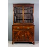 A George III mahogany secretaire bookcase, the upper part with moulded cornice with Greek key and