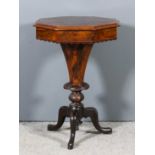 A Victorian figured walnut octagonal work table, the lifting top opening to reveal fitted