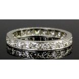 A modern platinum all diamond set full hoop eternity ring, the face channel set with twenty-three