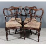A set of four Victorian mahogany dining chairs, the moulded kidney shaped backs with leaf carved