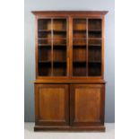A late Victorian mahogany bookcase, the upper part with moulded cornice, fitted six shelves,