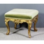 A French gilt framed rectangular stool of Louis XV design, upholstered in green dralon, the rails