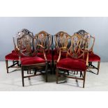 A set of seven early 20th Century mahogany shield back dining chairs of "Hepplewhite" design (