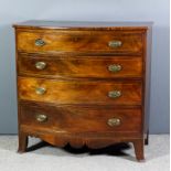 A late Georgian mahogany bow front chest inlaid with stringings, fitted four long graduated drawers,