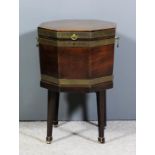 A George III mahogany and brass bound octagonal two handled wine cooler, on stand with square