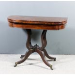 A George III mahogany D-shaped card table, the leather lined folding top on shaped and reeded