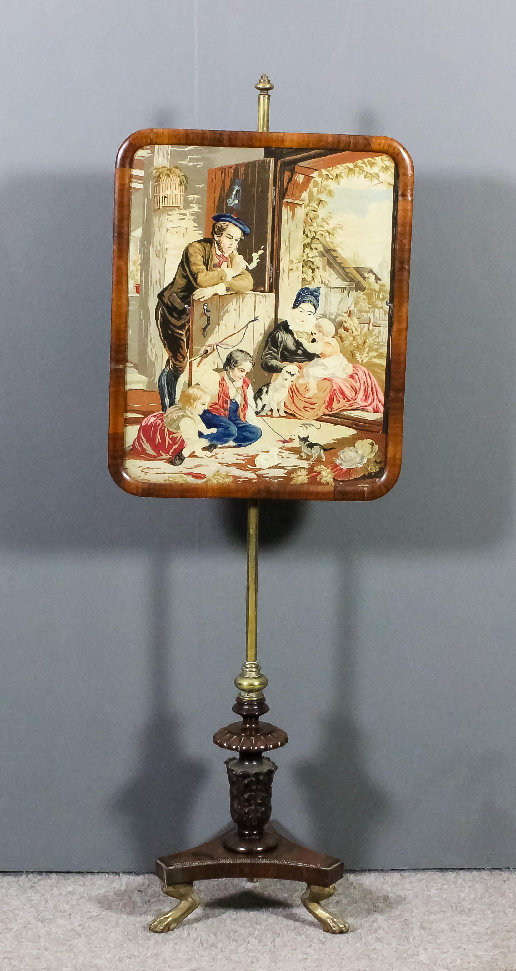 A Victorian rosewood framed pole screen with rectangular panel inset with Berlinwork of "The