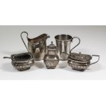 A late Victorian silver rectangular three piece condiment set with bead mounts, part reeded and