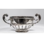 An Edward VII silver circular two-handled rose bowl with moulded rim and girdle, the lower body cast