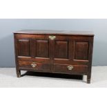 An 18th Century panelled oak mule chest with moulded edge to top, four raised panels to front,