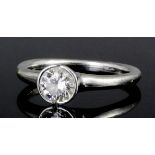 A modern platinum mounted diamond solitaire, the brilliant cut stone of approximately .70ct, in